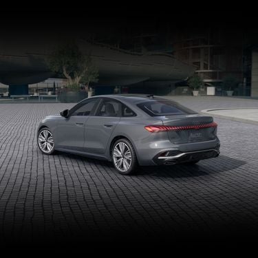 Three-quarter side view of the Audi A5 parked.