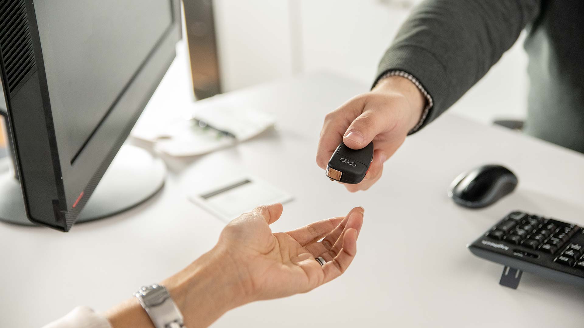 Audi sales technician working with a customer.