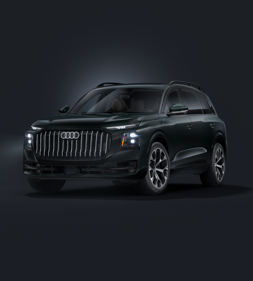 The Q9 SUV, viewed from the front at an angle against a dark background.