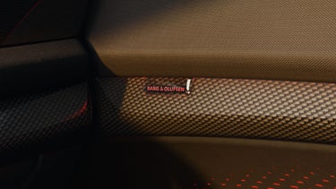 Close-up on the Bang & Olufsen speaker in the door of the Audi SQ7.
