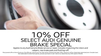 Service technician servicing vehicle. 