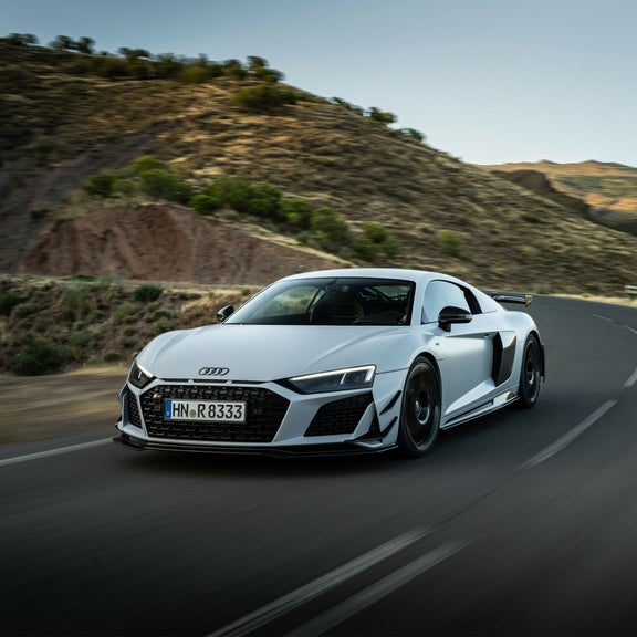 Three-quarter front profile of the Audi R8 GT accelerating.