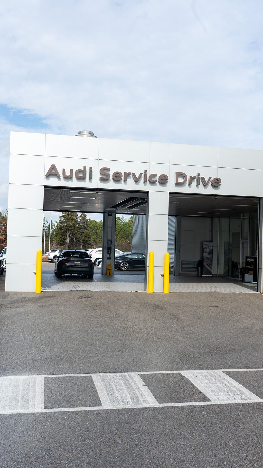 Front profile view of the Audi Service Center.