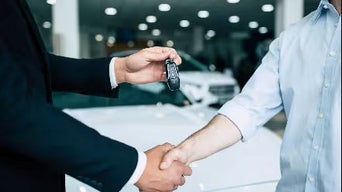 Handing over car keys.