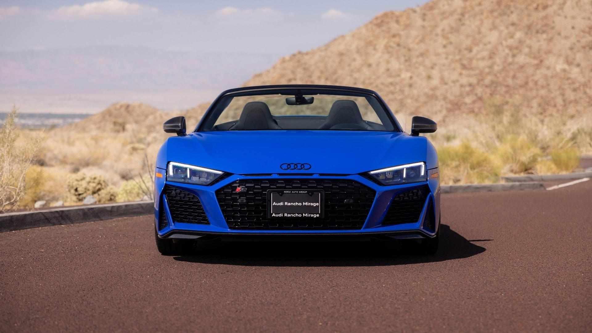 Front profile view of an Audi R8 vehicle parked.