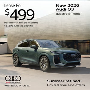 Side view of an Audi Q3 driving.