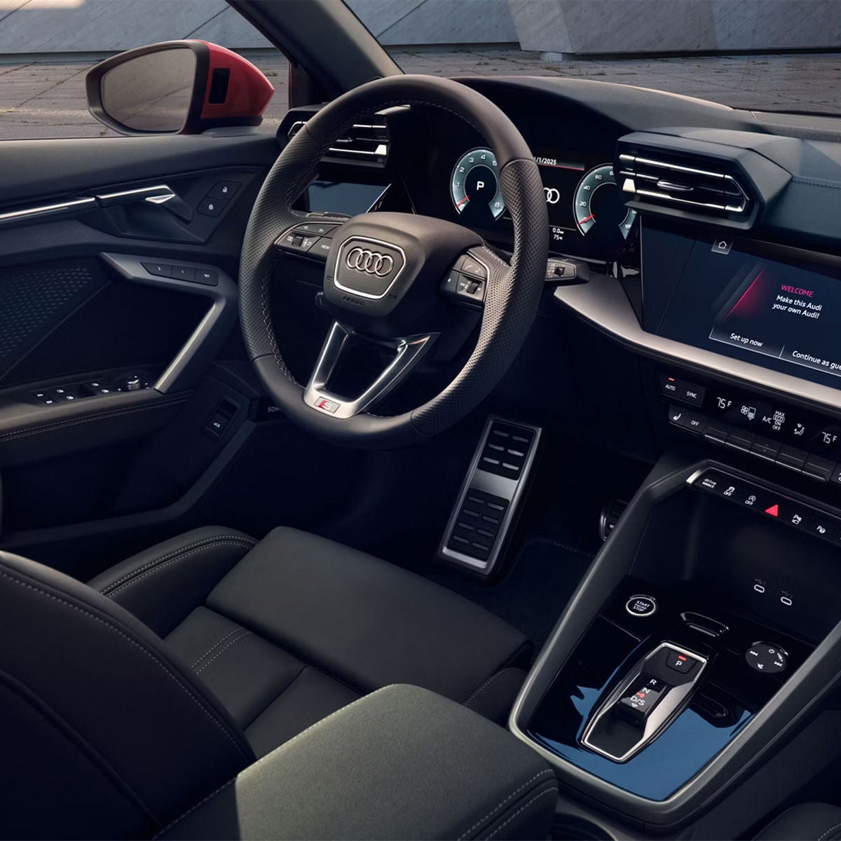 Interior view of the dashboard and front seat of the Audi A3.