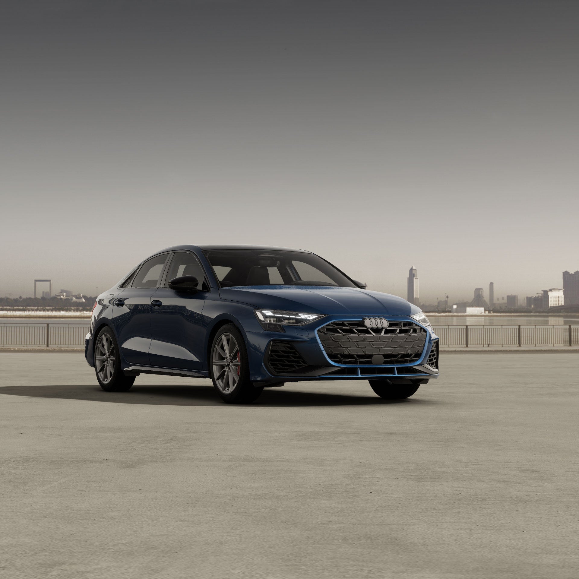 Three-quarter front view of the Audi S3 parked by a cityscape.