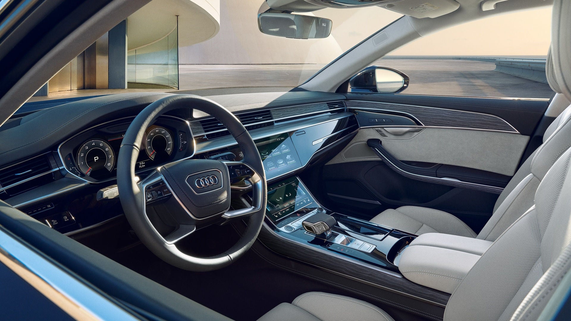 Audi A8 dashboard with technology, along with the front row and steering wheel.  