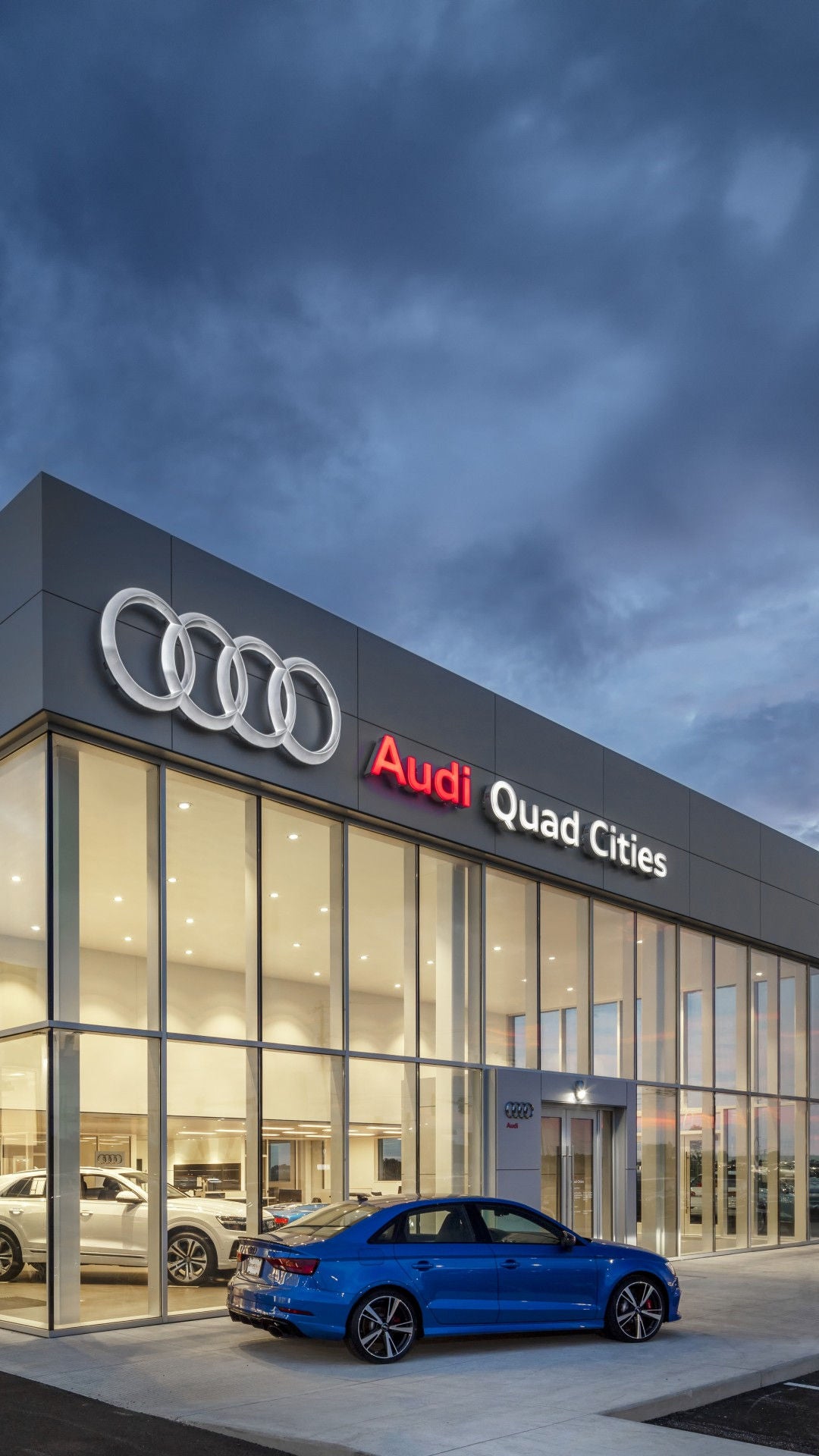 Audi 2025 Audi Q6 e-tron left profile driving.