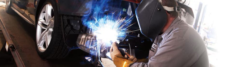 Three quarter view of an Audi Q8 SUV parked.