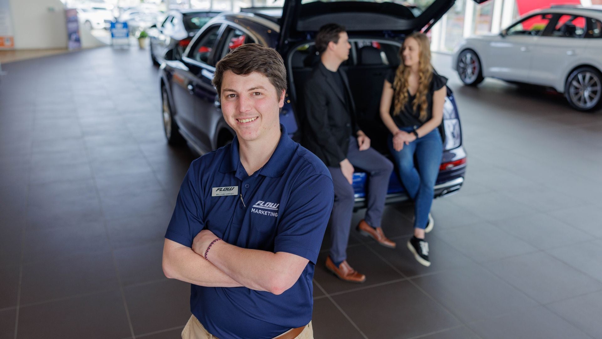 Audi Sale Specialist explaining vehicle features to a customer.