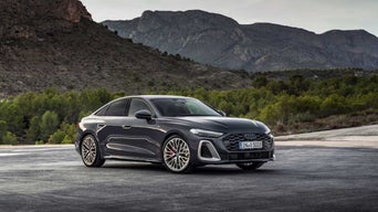 Three-quarter front view of a 2025 Audi A5 model.