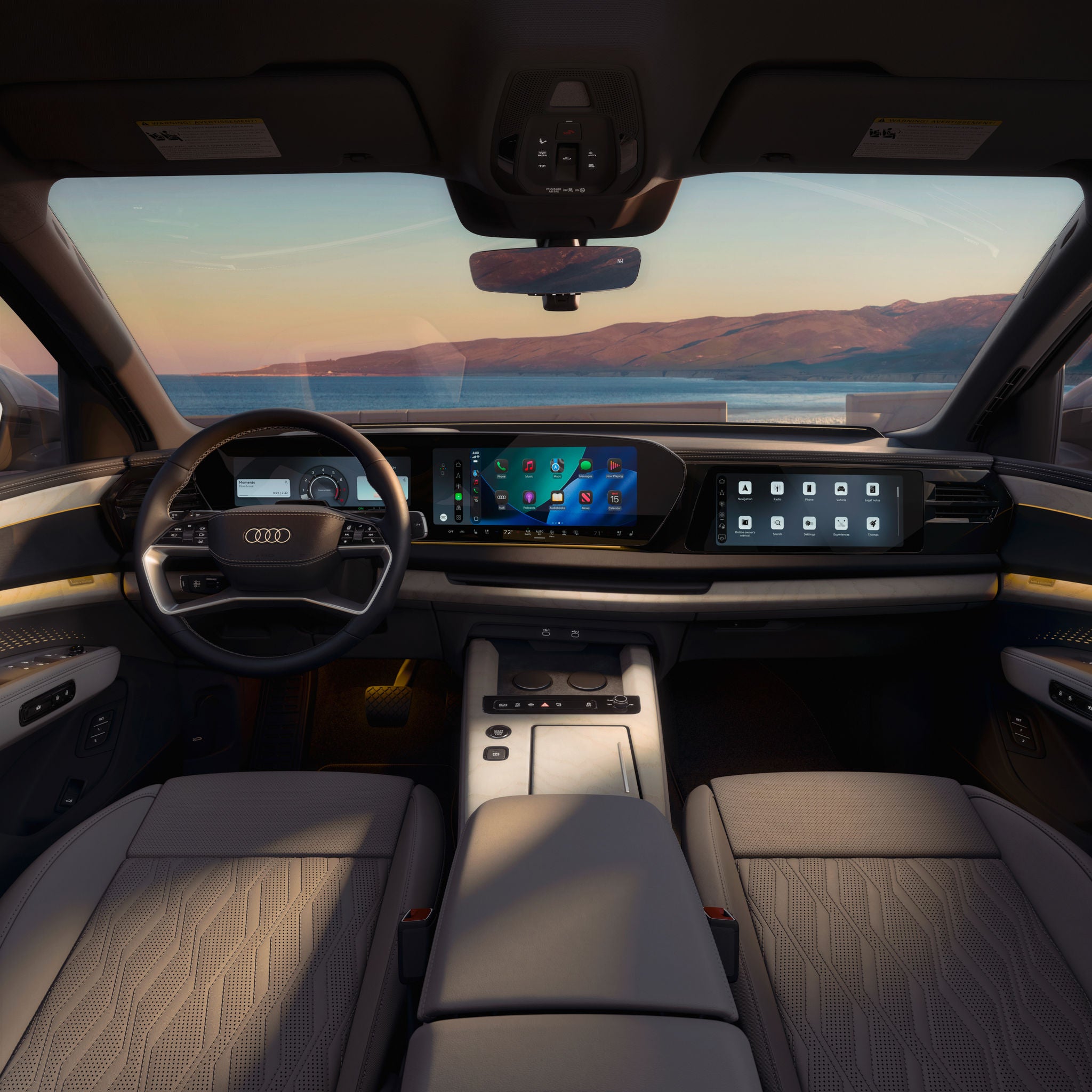 Interior of the 2027 Audi Q9 featuring a digital cockpit, passenger display and premium seating.
