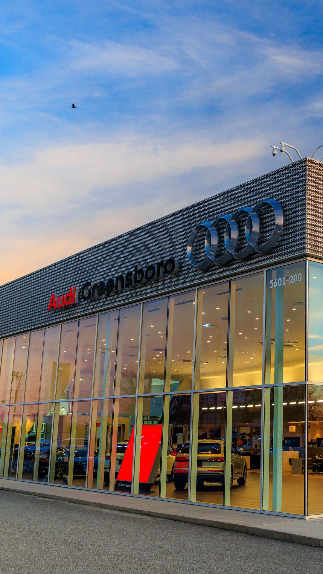 Audi 2025 Audi Q6 e-tron left profile driving.