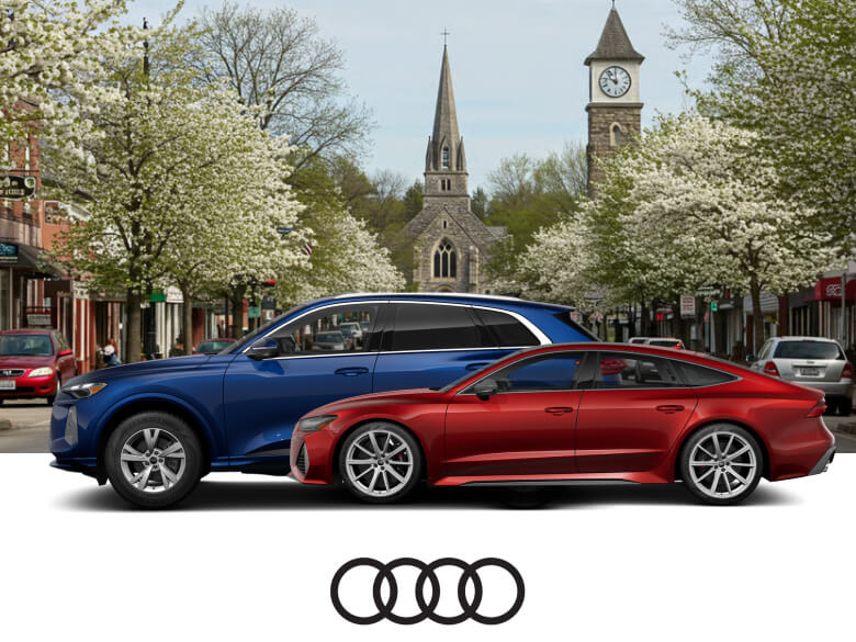 2025 Audi Q5 in Navarra Blue and 2026 Audi RS 7 in Grenadine Red over a Great Barrington backdrop