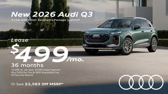 Side view of an Audi Q3 parked.