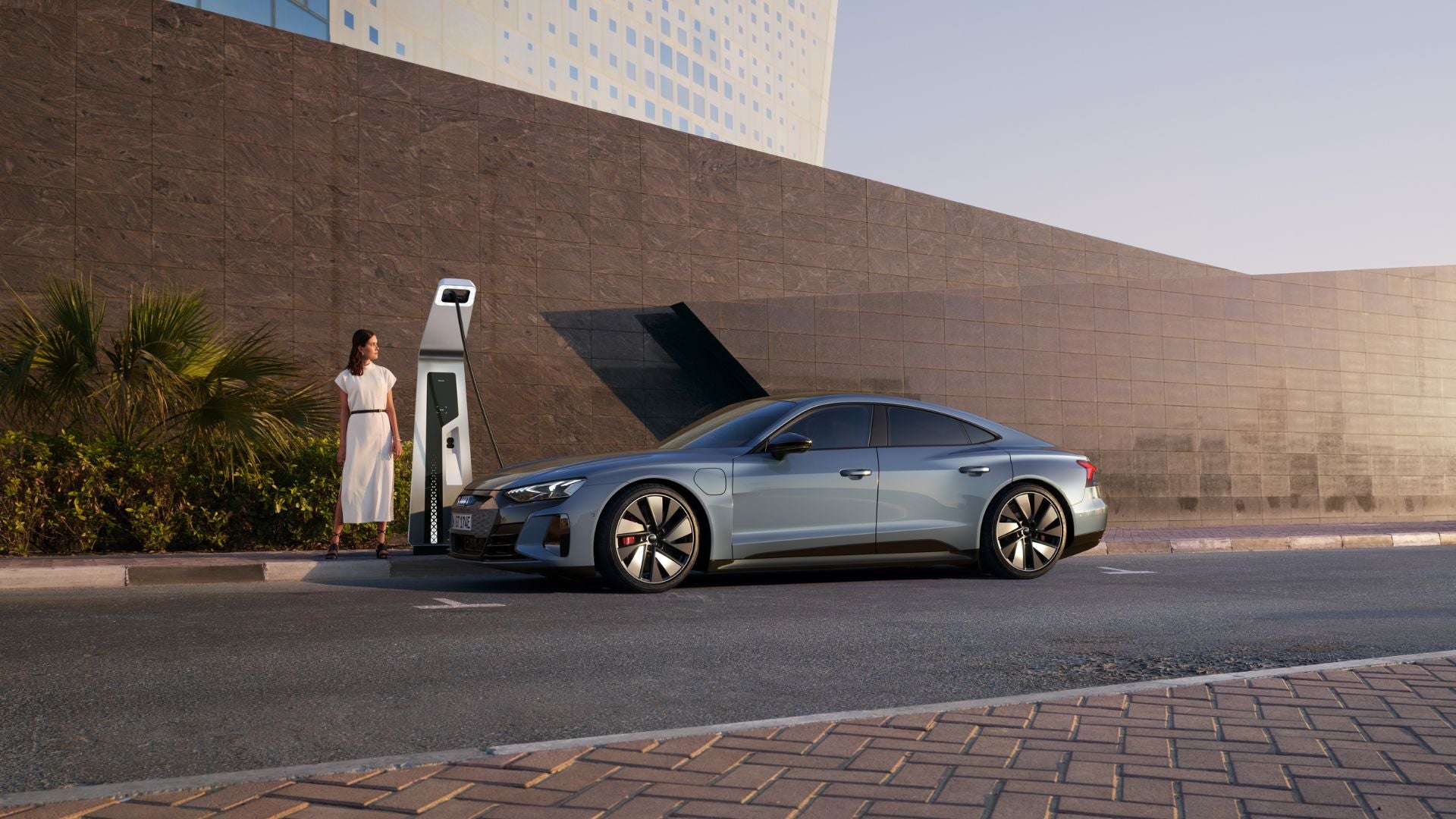 image of girl charging an e-tron