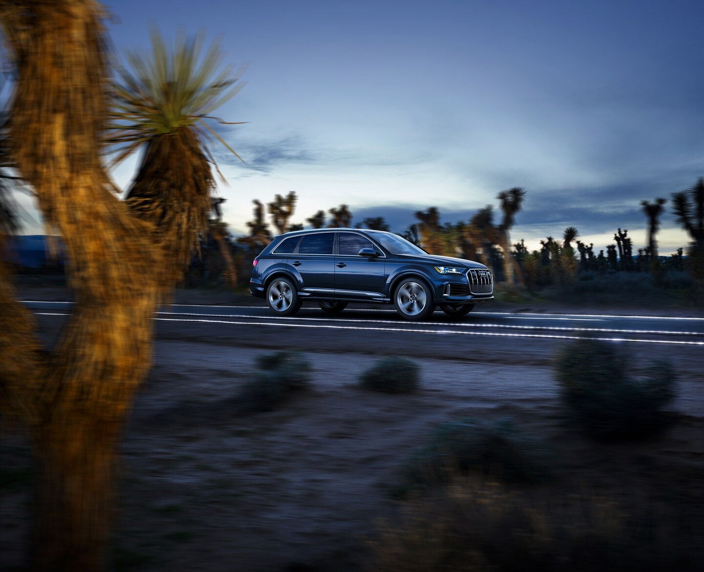 Audi Q7 side view on a rainy day
