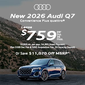 Side view of an Audi Q7 driving.