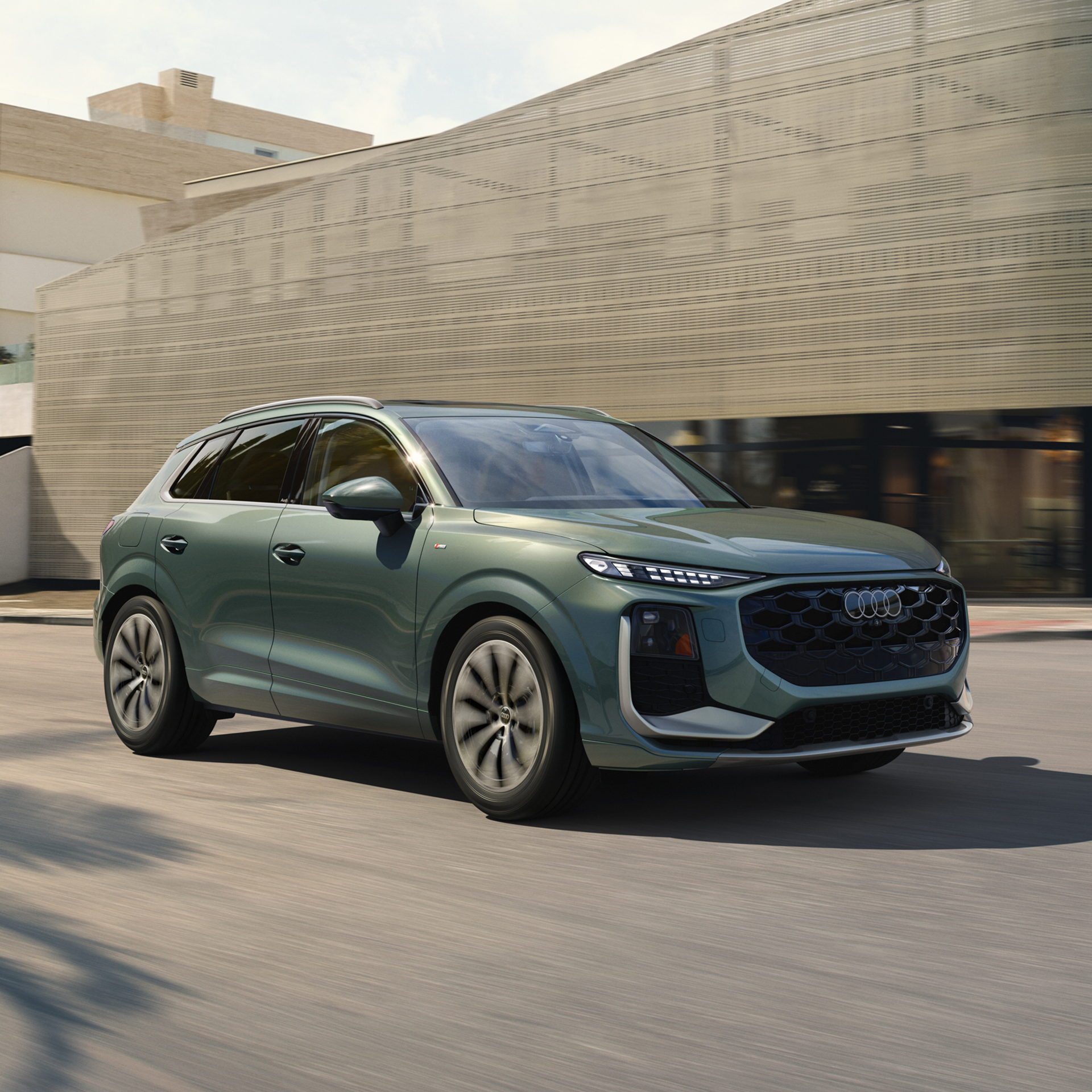 Audi 2026 Audi Q3 right profile driving.