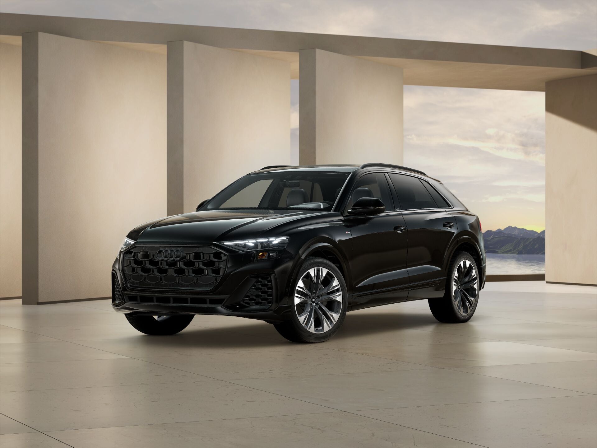 2026 Audi Q8 trim level Premium Plus in black parked by modern structure