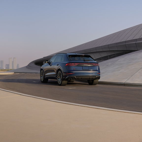 Rear profile of the Audi SQ8 accelerating.