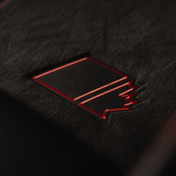 Close-up on the Maple Leaf Edition embroidery on the floor mats of the Audi SQ7.