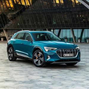 Three-quarter front-view of the Audi e-tron parked.