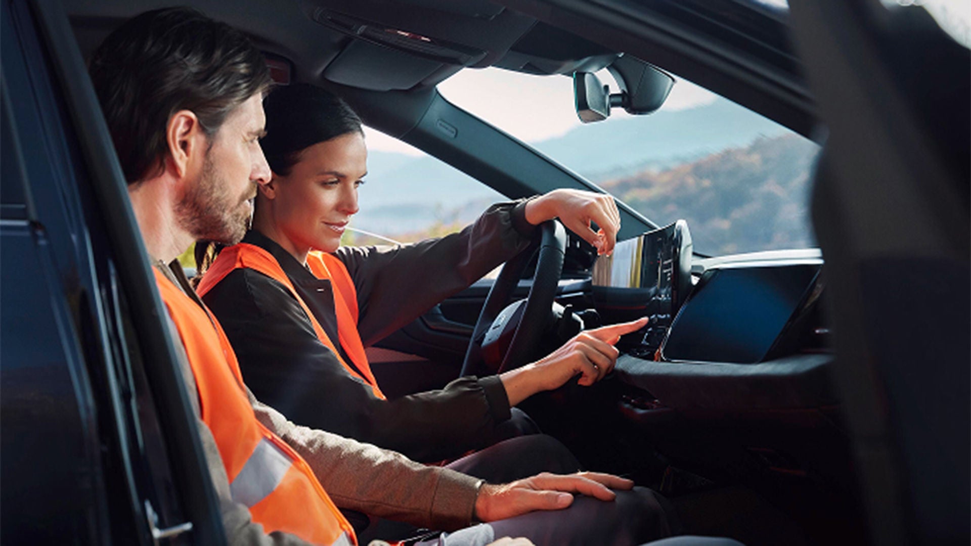 Interior view of a woman sitting in an Audi vehicle.