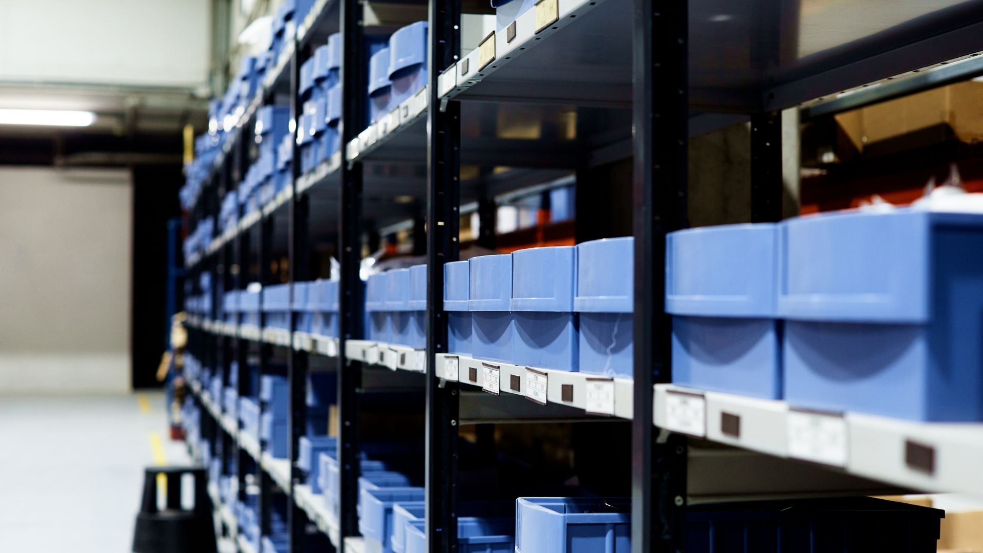 Dealer parts shelf - blue boxes lined up