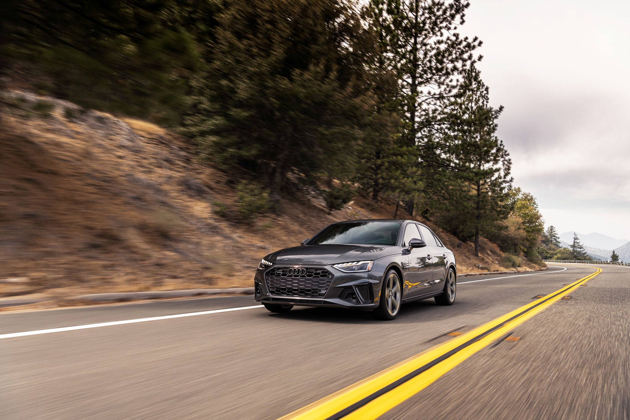 Front profile view of Audi A4 Sedan driving.