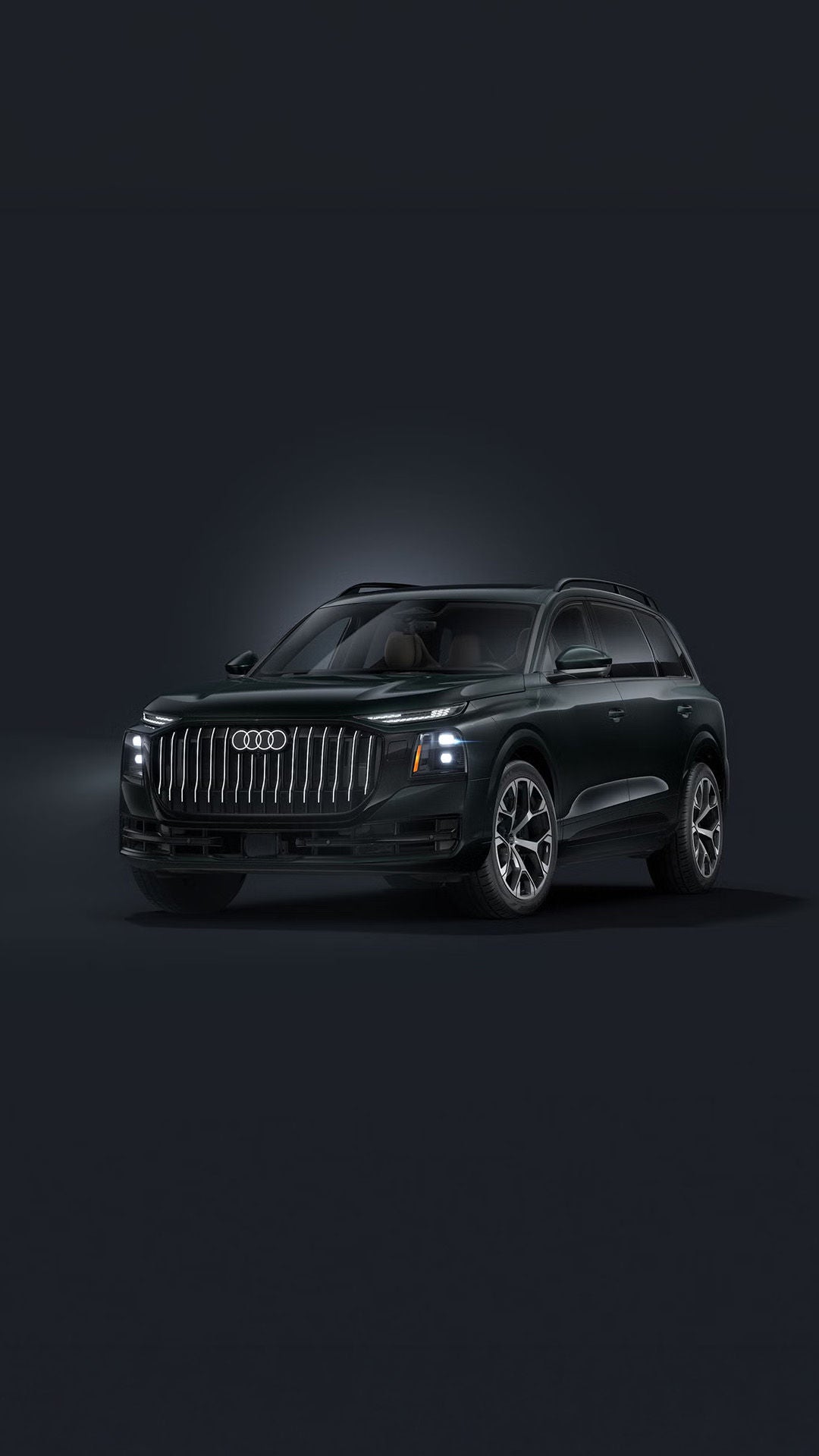 The Q9 SUV, viewed from the front at an angle against a dark background.