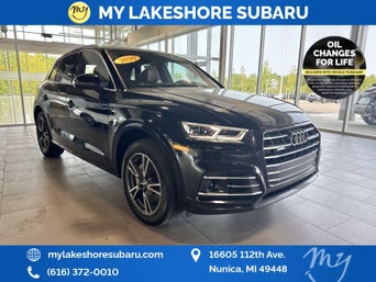 Service technician serving vehicle.