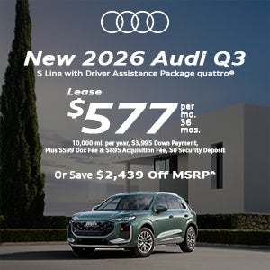 Side view of an Audi Q3 parked.