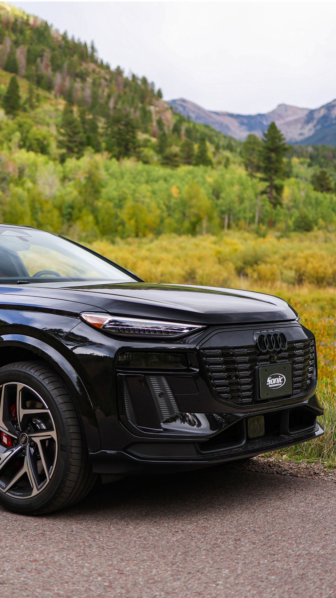 Audi 2025 Audi Q6 e-tron left profile driving.