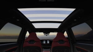 Panoramic glass sunroof of the 2027 Audi Q9 at sunset.