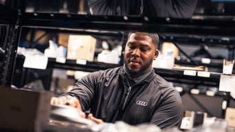 Audi merchandising staff working. 