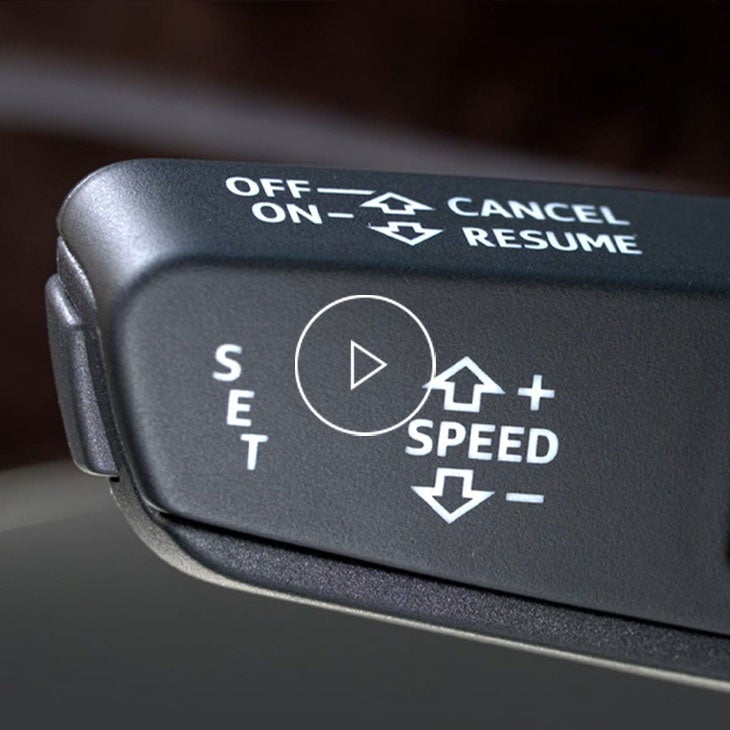 Close up on the cruise control stalk inside an Audi vehicle. 