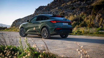 Green Q5 sportback parked with side view