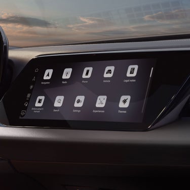 View of the interior cabin of the Audi A5, showing the passenger display screen and the dashboard.