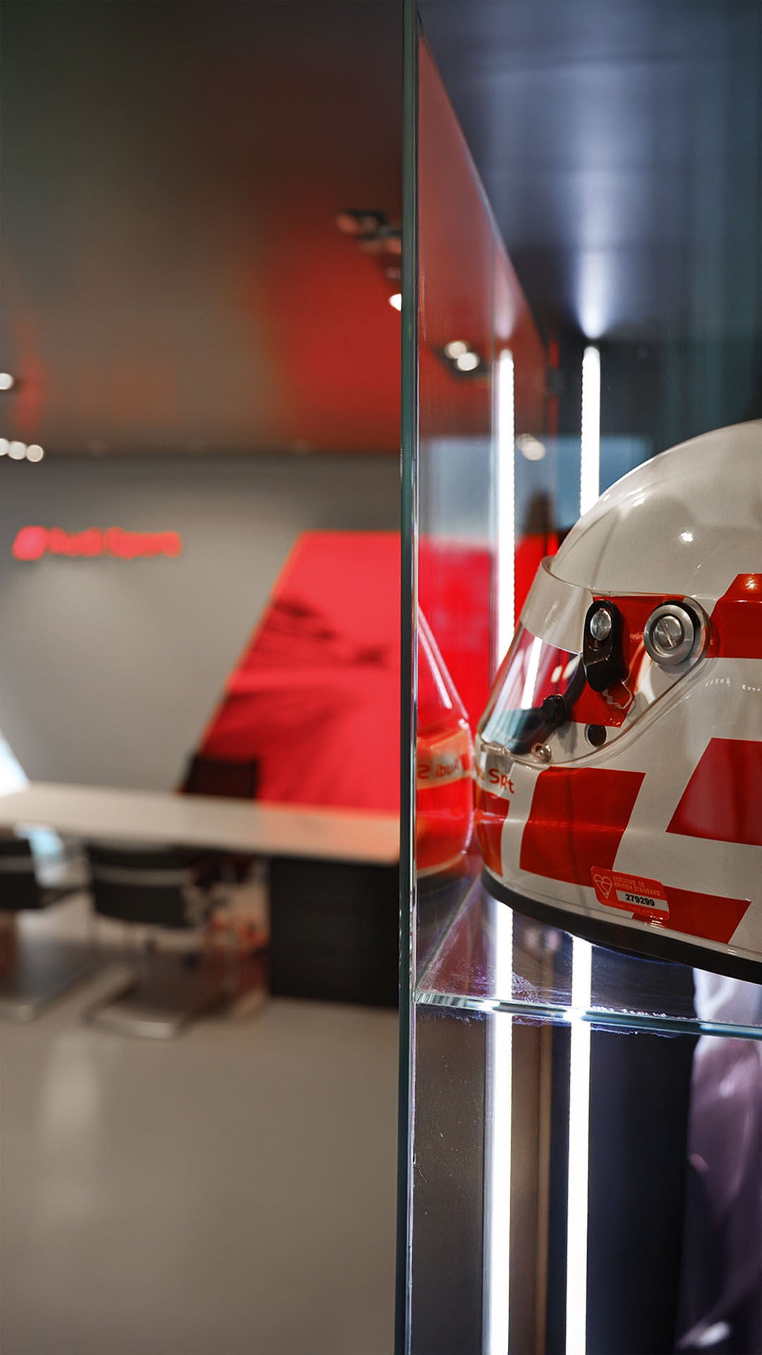 Audi Sport corner with a racing helmet