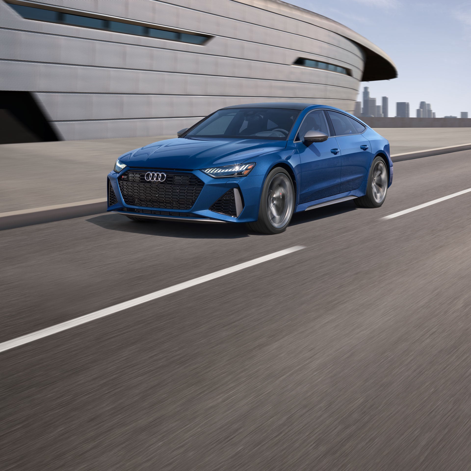 Three quarter front view of the Audi RS 7 performance accelerating.