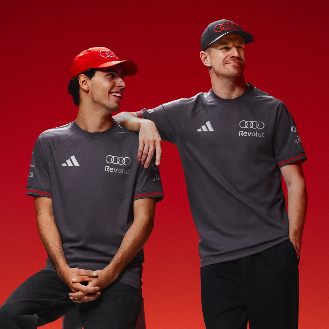 A photo of Nico Hulkenberg and Gabriel Bortoleto wearing Audi F1 gear