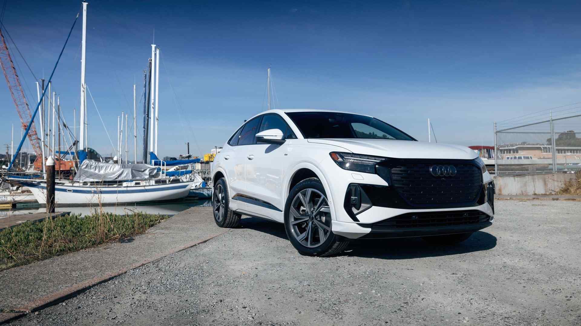 Front profile view of an Audi Q4 parked.