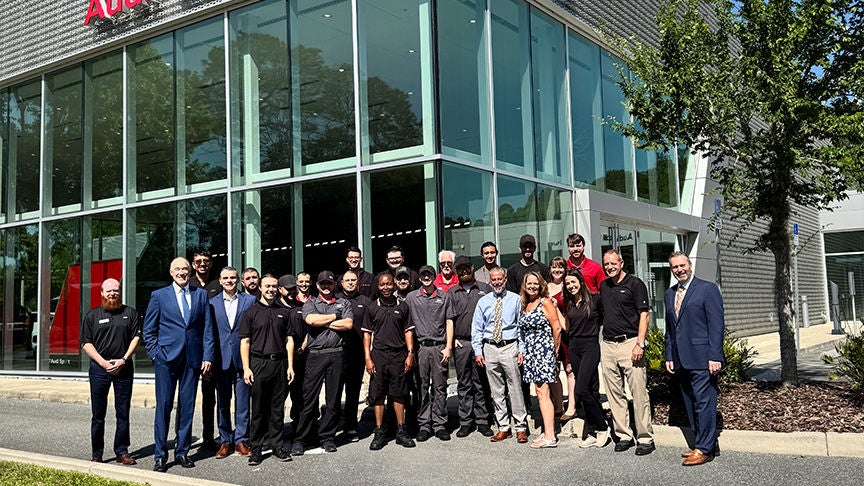 Audi employee polishing an Audi SUV