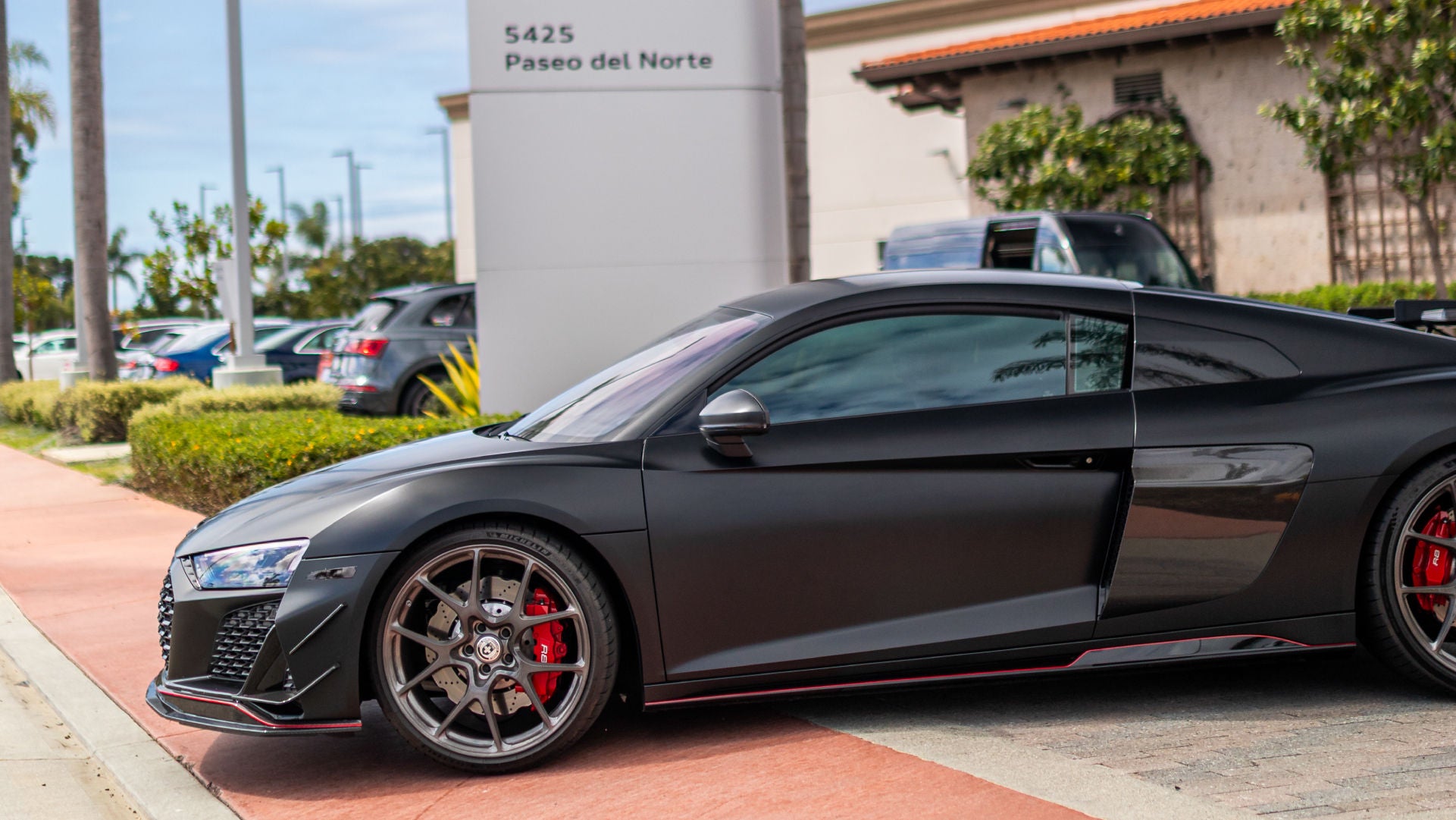 Black Audi R8 leaving Audi Carlsbad driveway