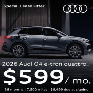 Gray Audi Q4 e-tron plugged in