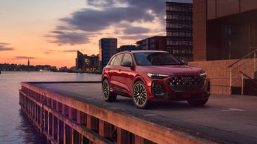 Three-quarter front-view of an Audi SQ5 parked on a pier.