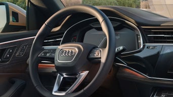  Interior dashboard view showing the digital cockpit and luxury trim of the Audi Q8 